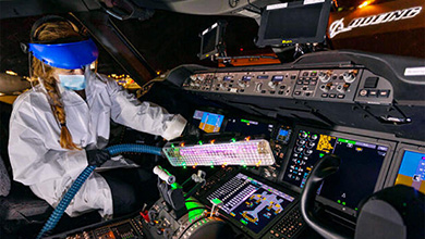 A worker cleaning an airplane.