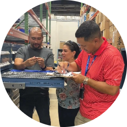 Boeing Employees looking in a drawer