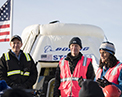 Picture of NASA astronaut Suni Williams Boeing&rsquo;s Chris Ferguson and Louis Atchison in front of CST-100 Starliner after historic landing on Dec. 22, 2019. (Credit: NASA)