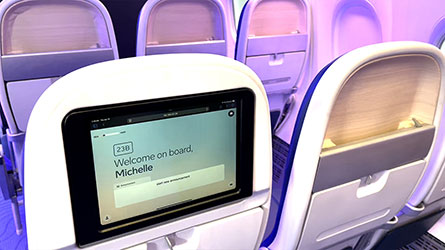 A mock-up demonstrates Boeing’s developmental speech-to-text transcription concept. The prototype shows cabin announcement captions in nearly real time to enhance accessibility for passengers.